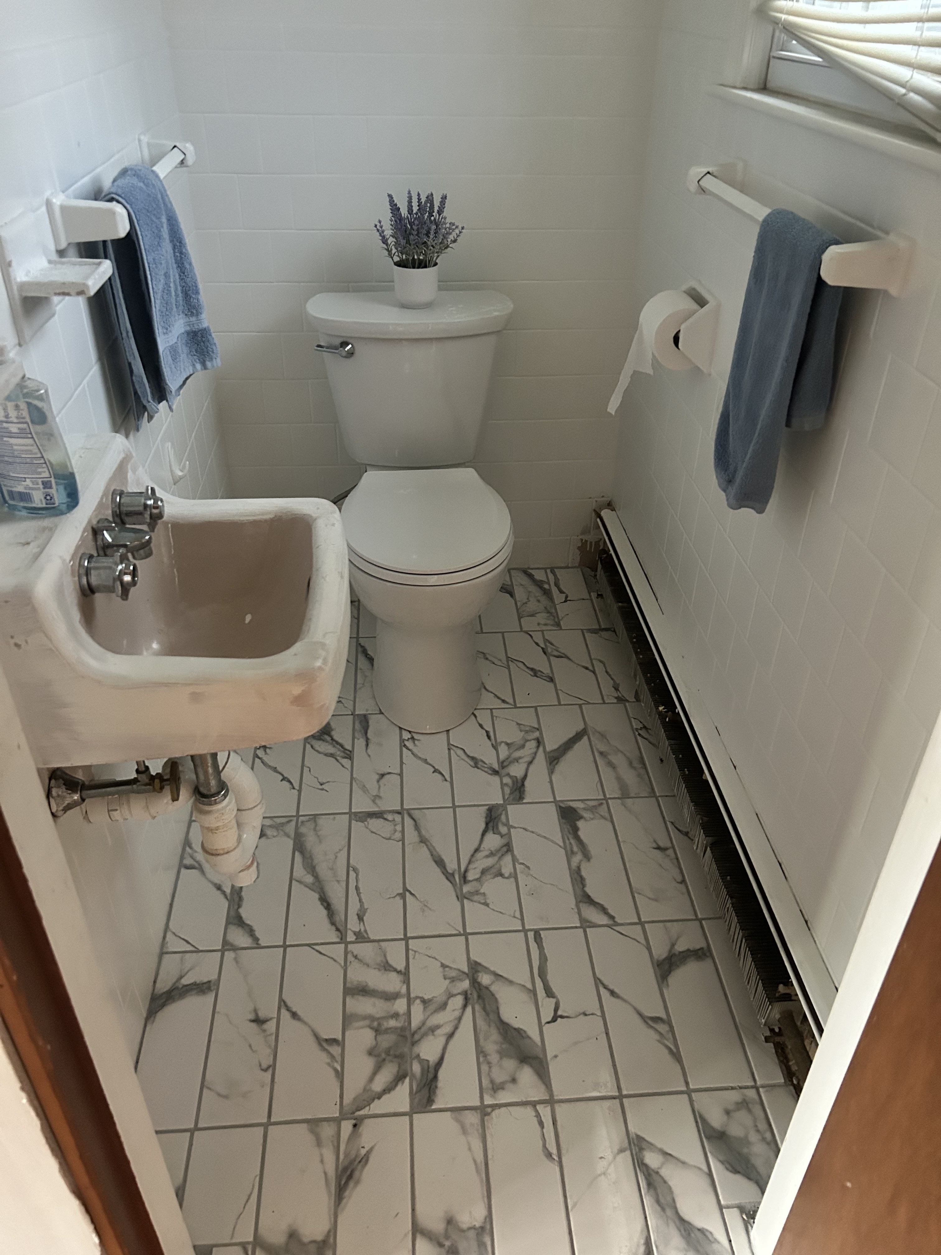 Finished bathroom tile floor installed in a Rhode Island home