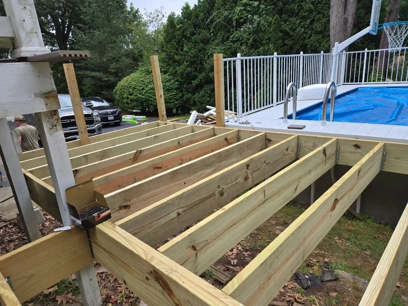 New pressure-treated pool deck framing built by Cook Flooring