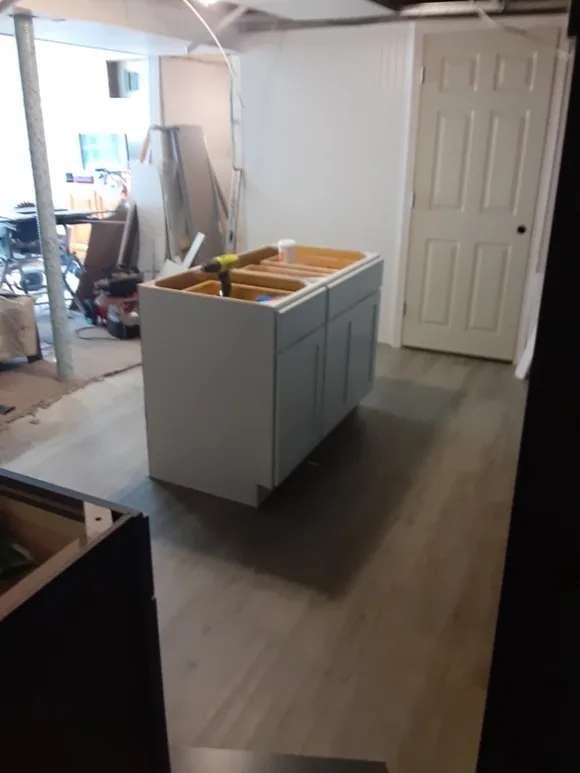 LVP flooring installed neatly around a kitchen island