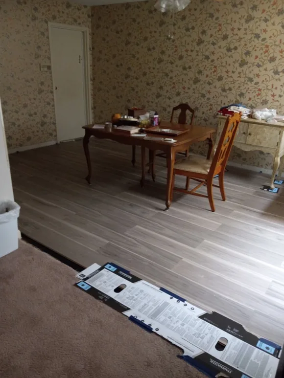 Finished LVP flooring in an open dining room