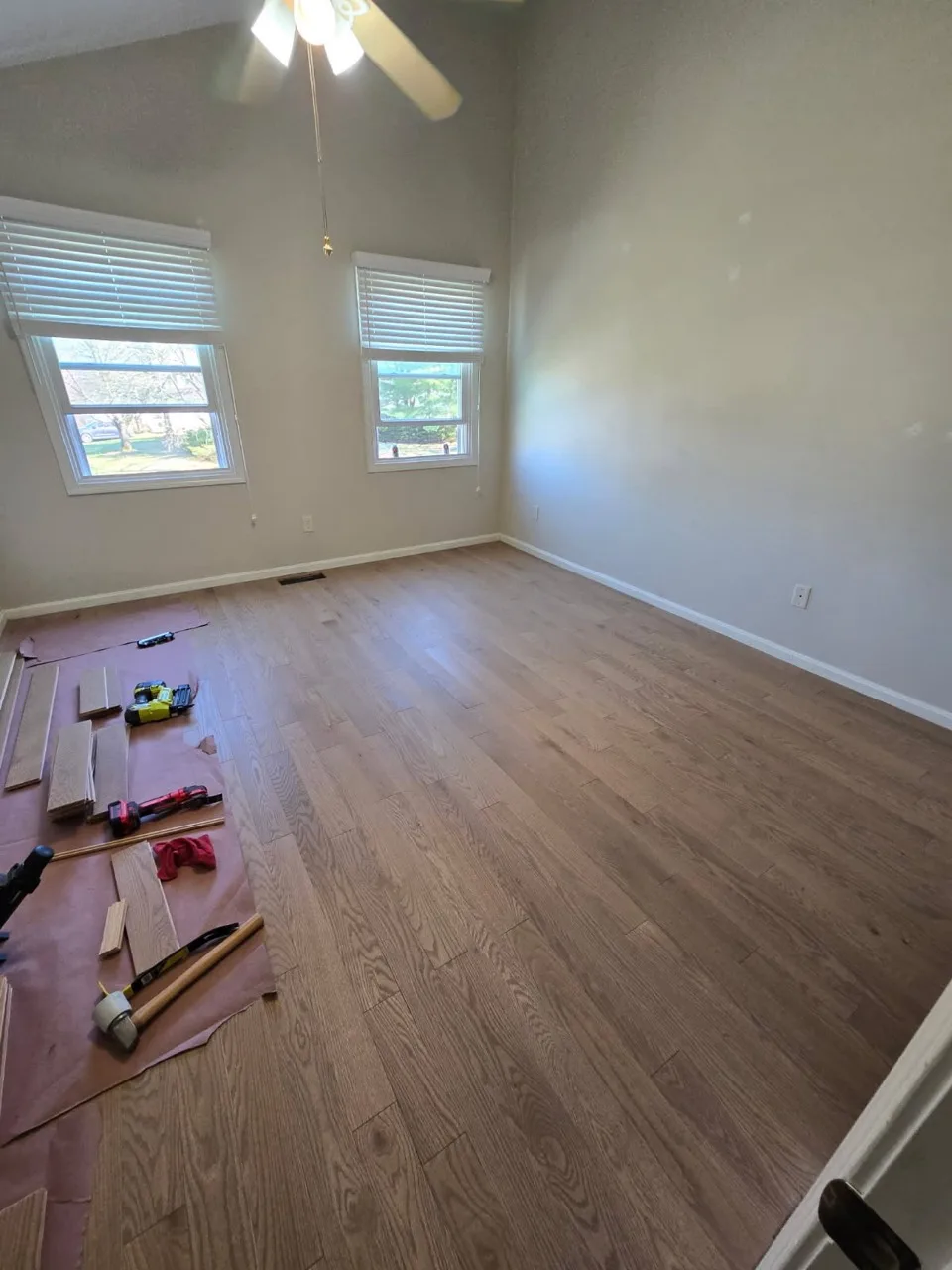 White oak hardwood installed across a bright Rhode Island room