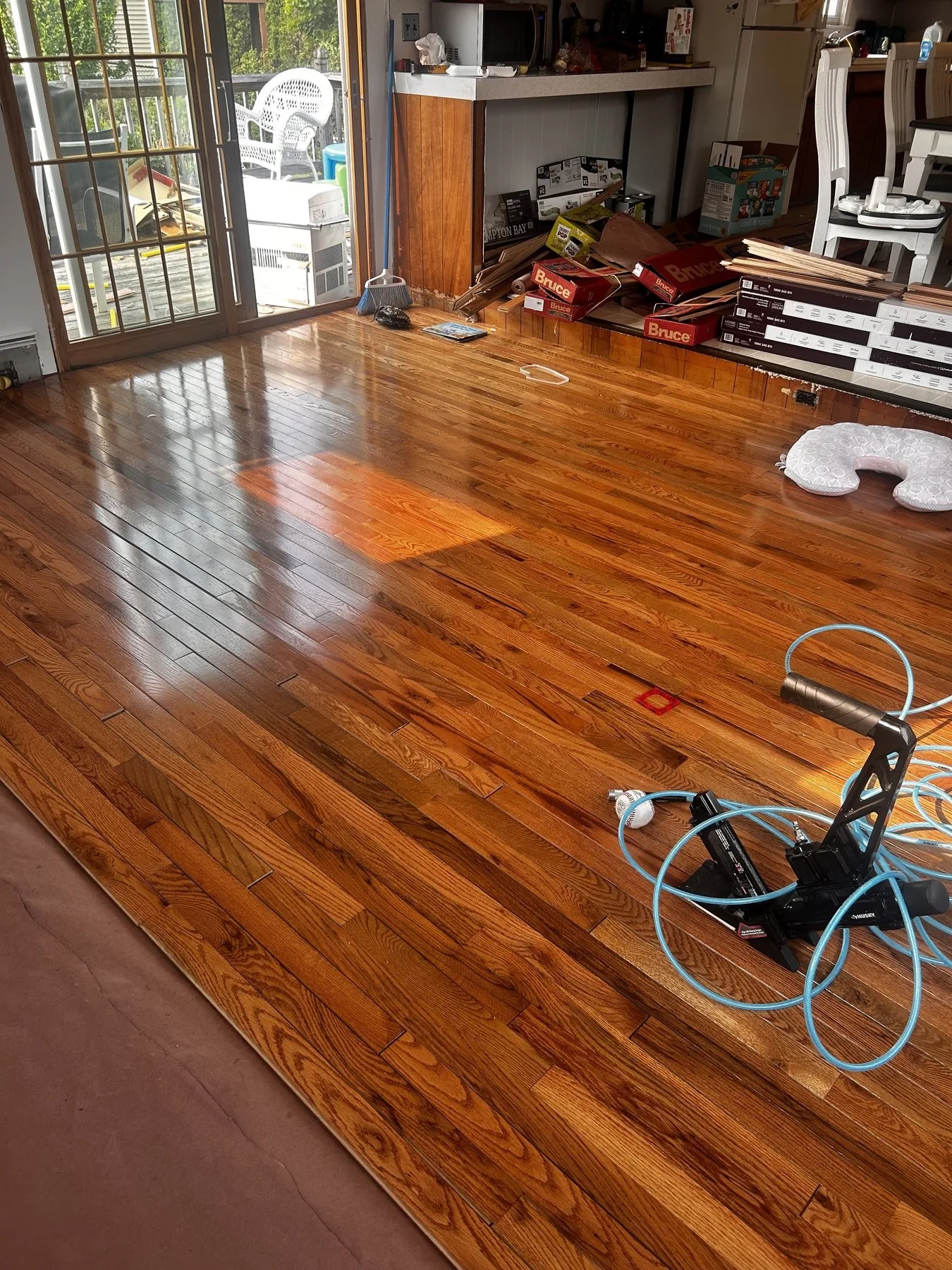 Finished amber hardwood floor installed in a Rhode Island home