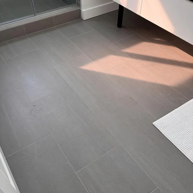 Finished bathroom floor tile installed by Cook Flooring